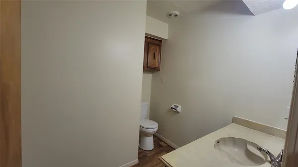 a bathroom with a toilet and sink