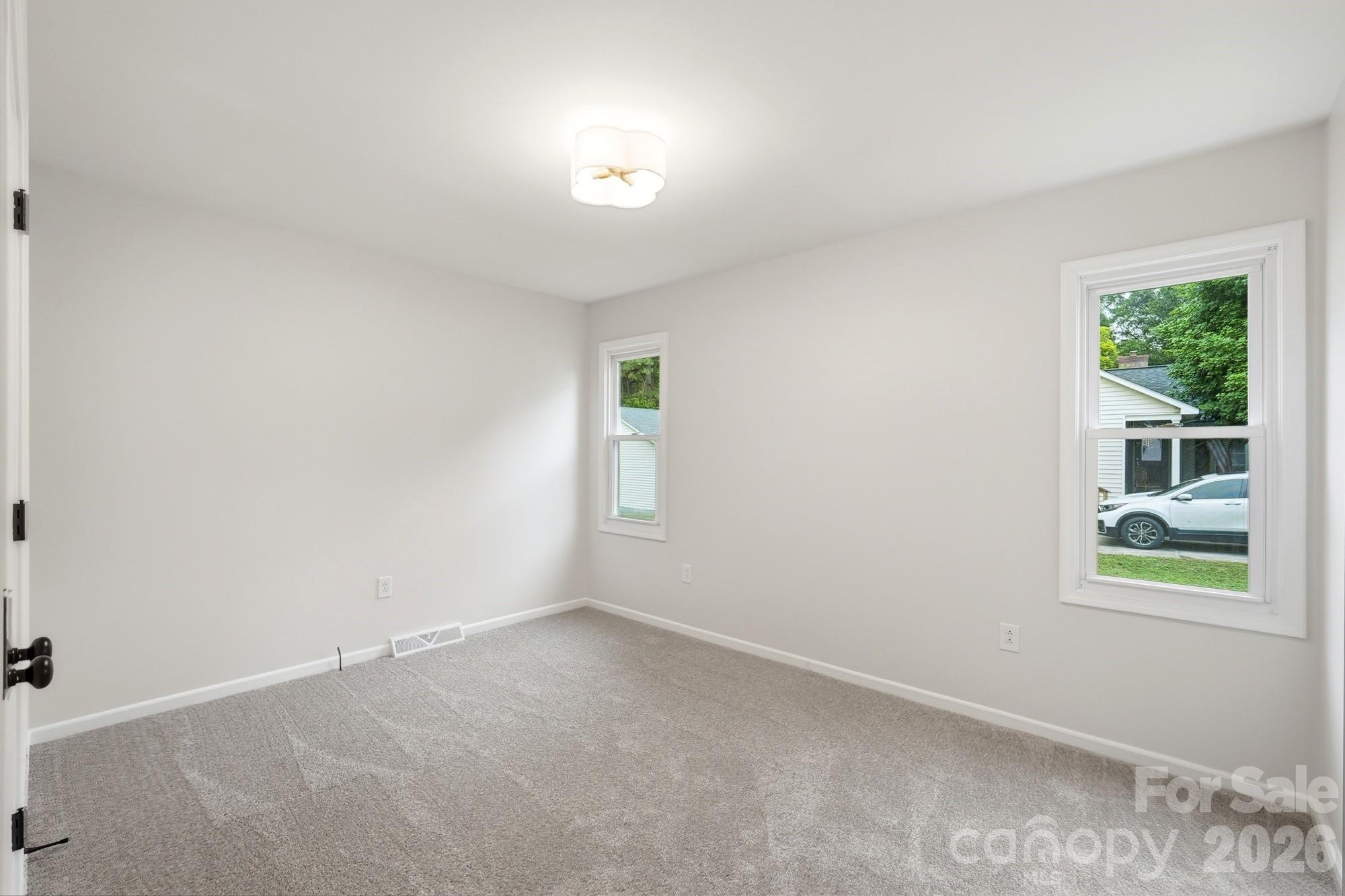 1235 Winecoff School Road Concord, NC 28027 - Photo 11 of 27 an empty room with windows