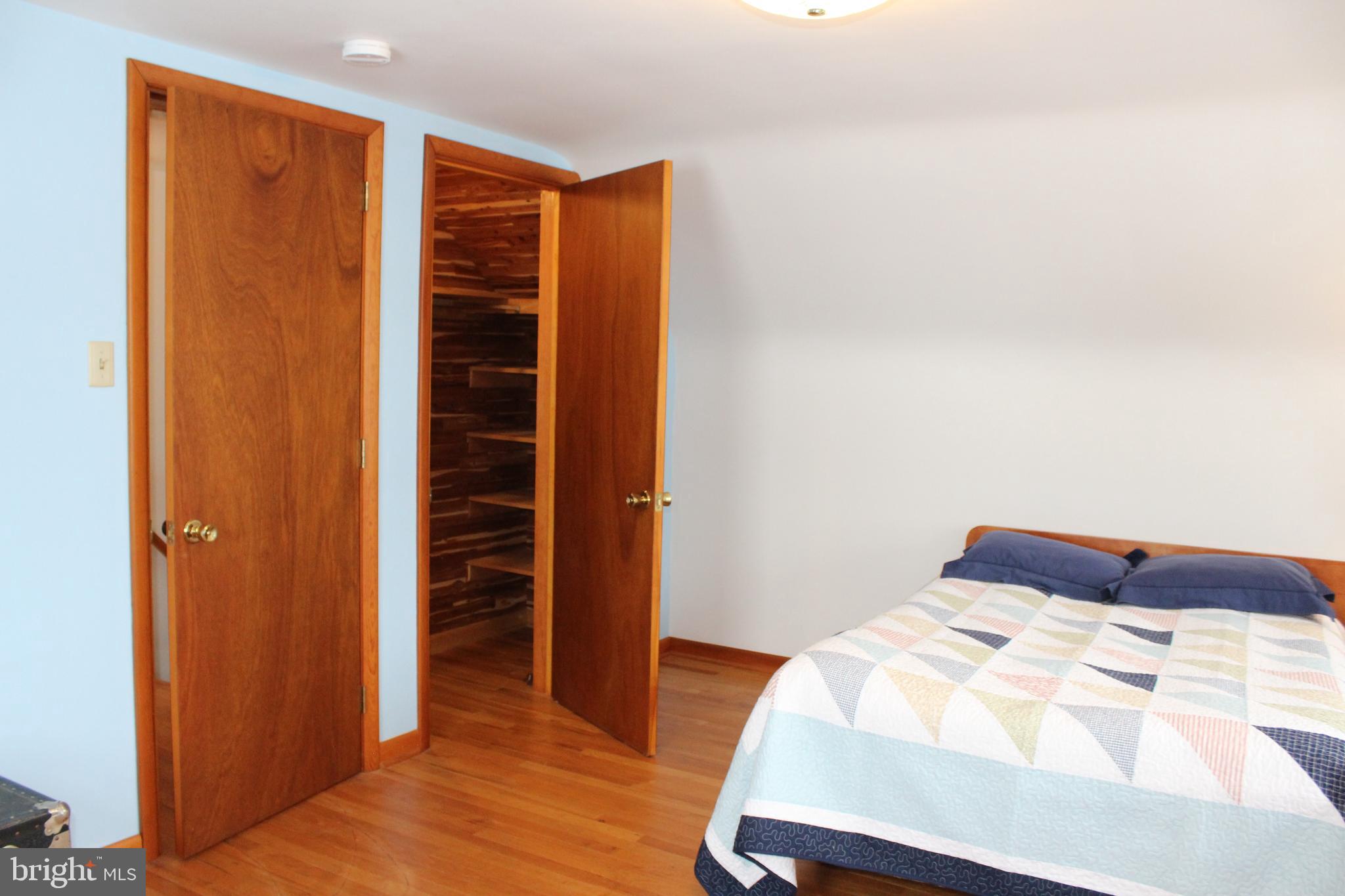 1120 Graystone Road Manheim, PA 17545 - Photo 22 of 42 a bedroom with a bed and wooden floor