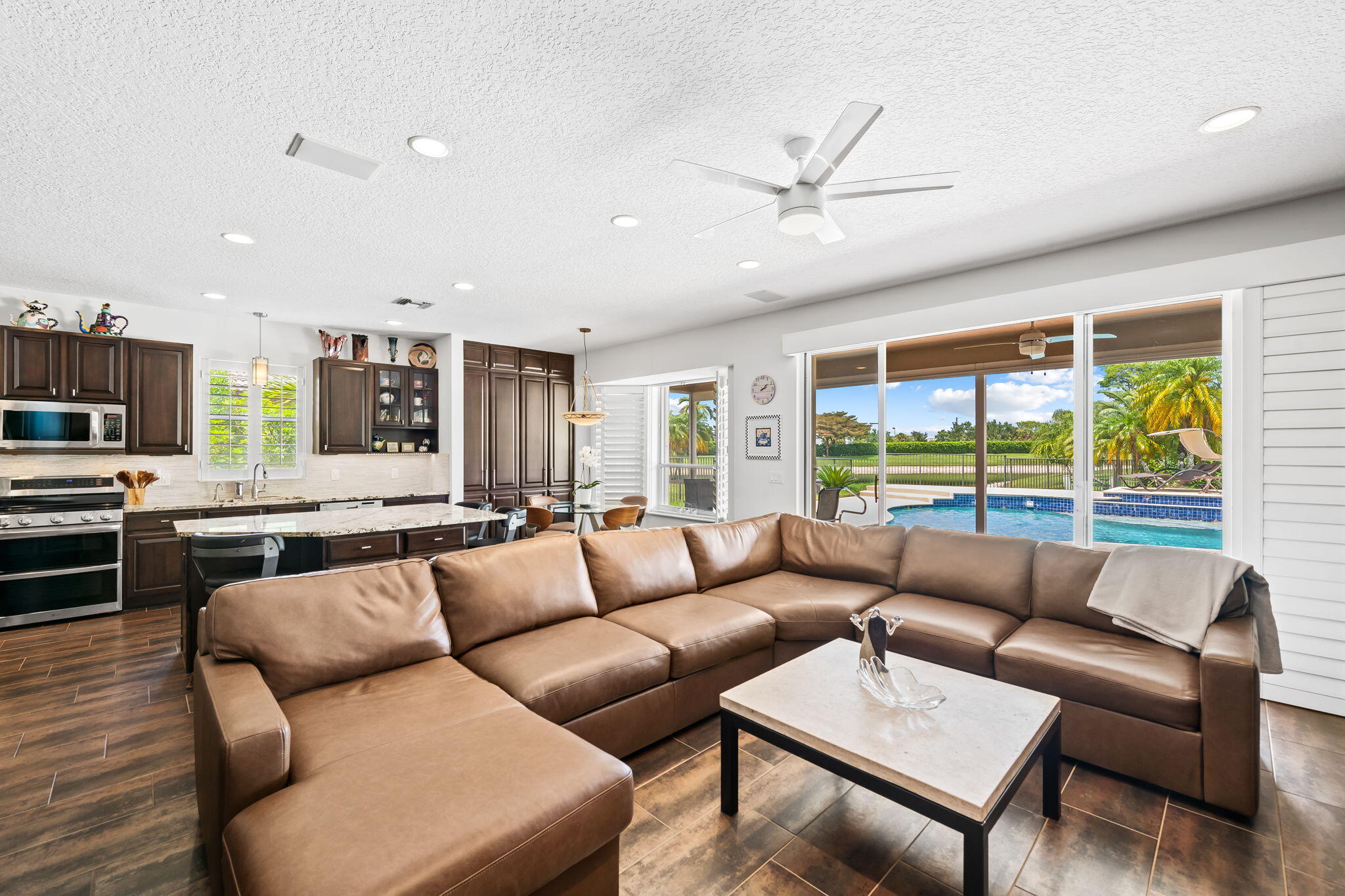 12781 Yardley Drive Boca Raton, FL 33428 - Photo 13 of 55 a living room with furniture and a large window