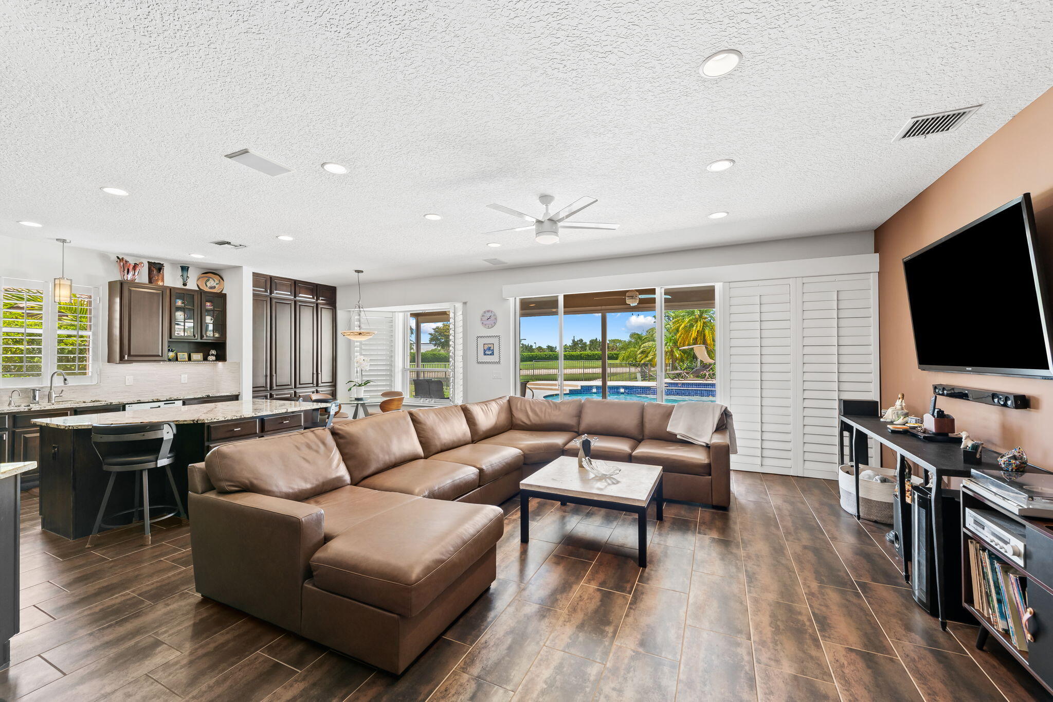 12781 Yardley Drive Boca Raton, FL 33428 - Photo 14 of 55 a living room with furniture and a flat screen tv