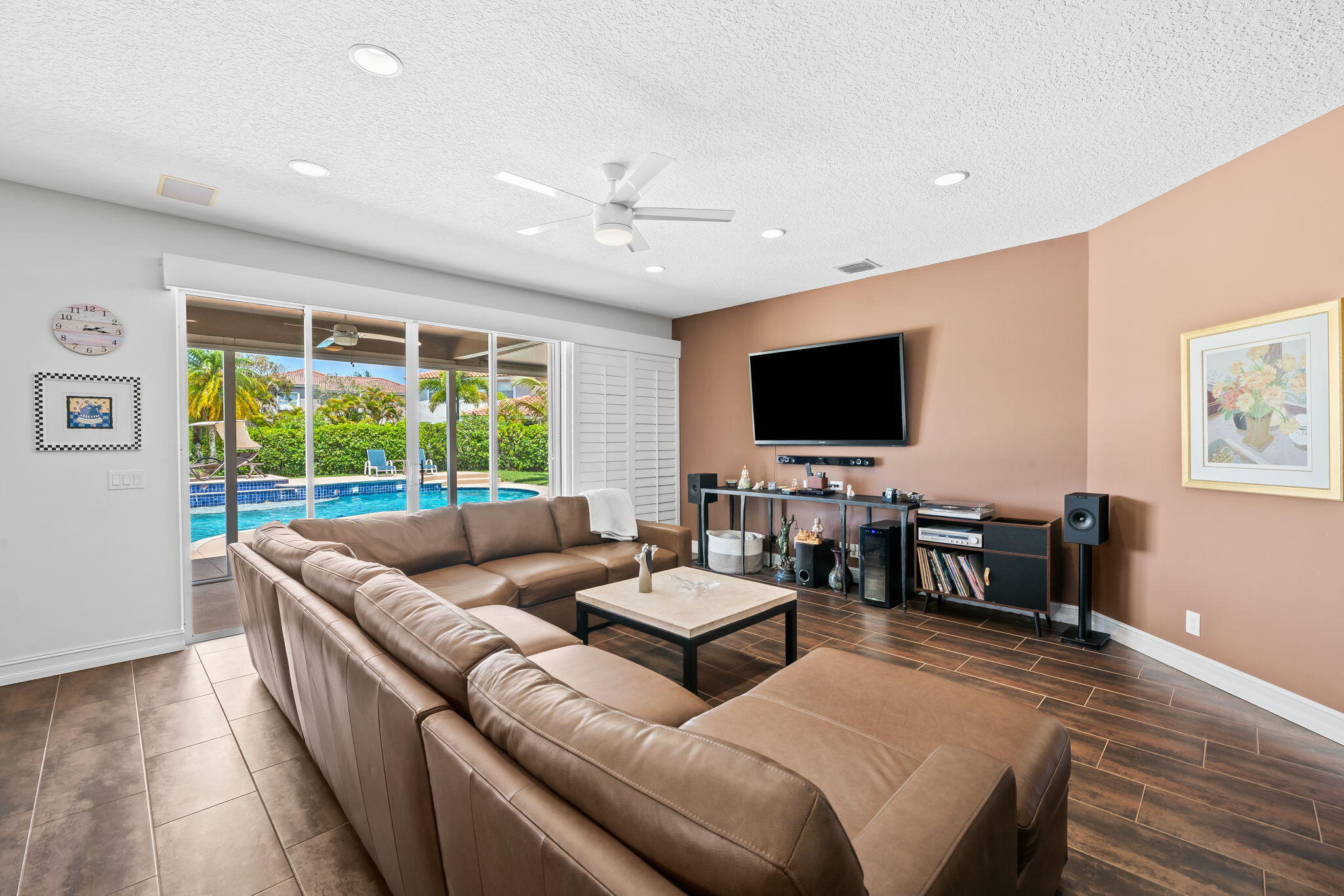 12781 Yardley Drive Boca Raton, FL 33428 - Photo 15 of 55 a living room with furniture and a flat screen tv
