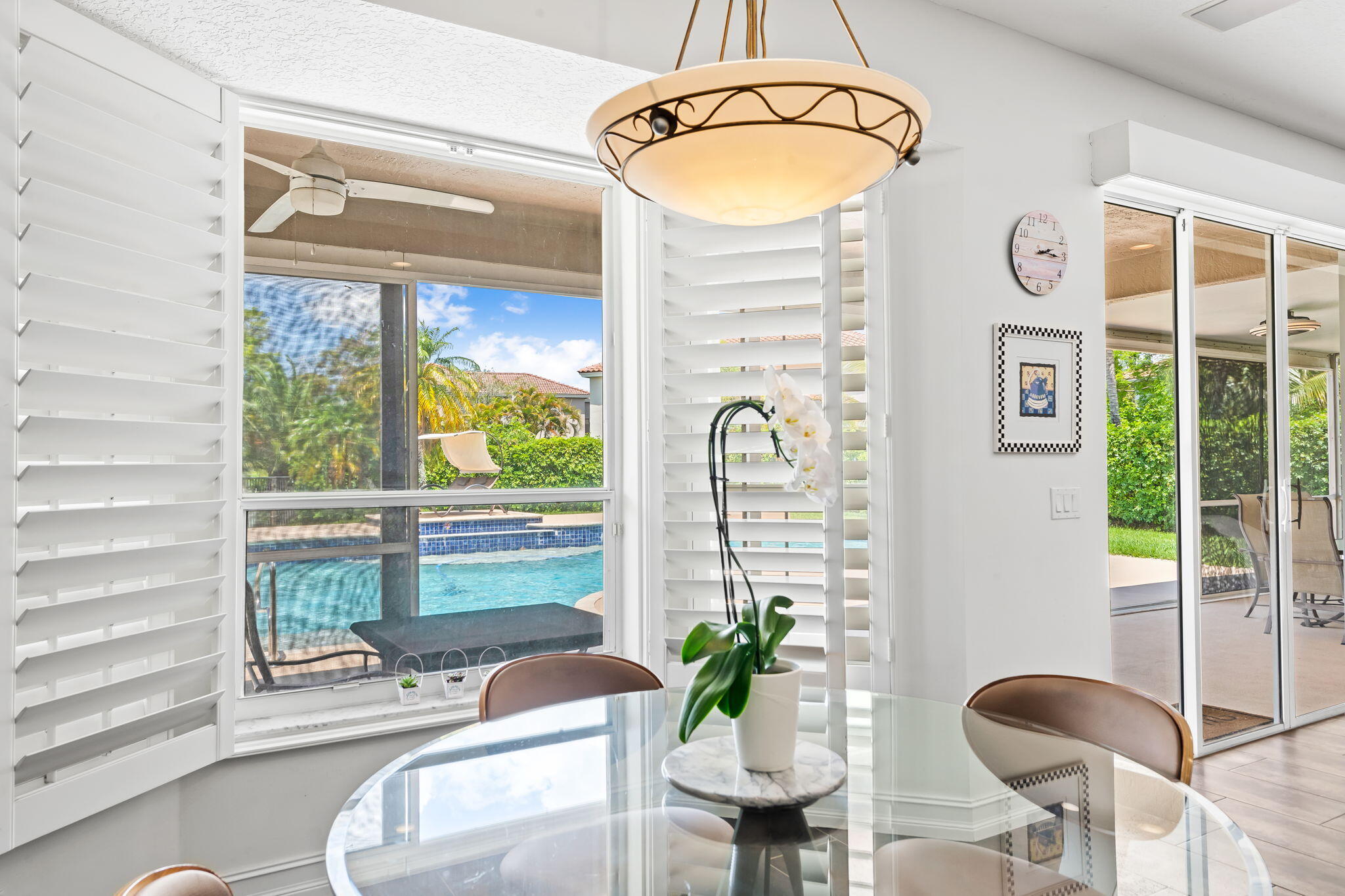12781 Yardley Drive Boca Raton, FL 33428 - Photo 16 of 55 a view of a dining room with furniture window and outside view