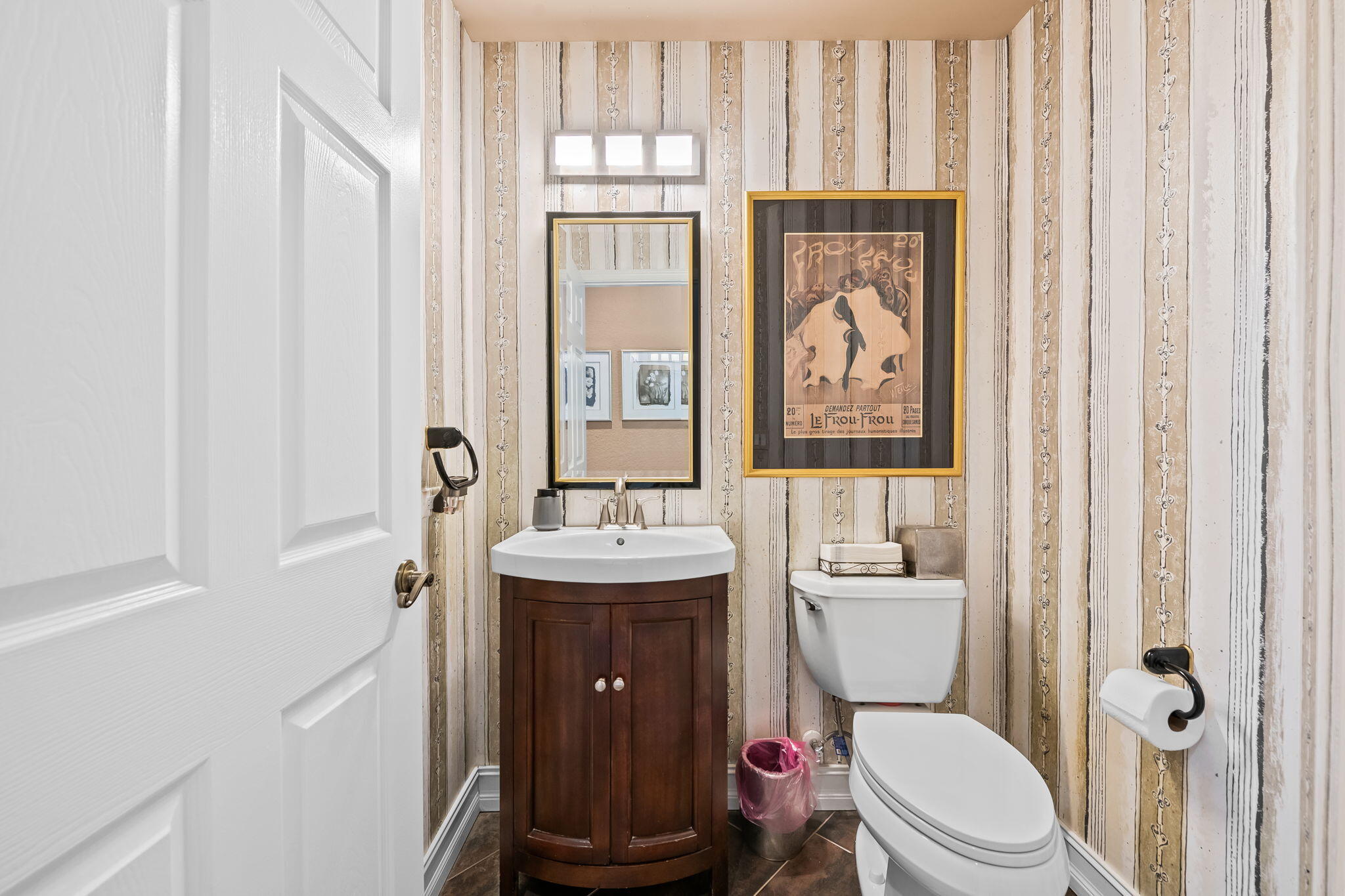 12781 Yardley Drive Boca Raton, FL 33428 - Photo 17 of 55 a bathroom with a toilet a sink and a mirror