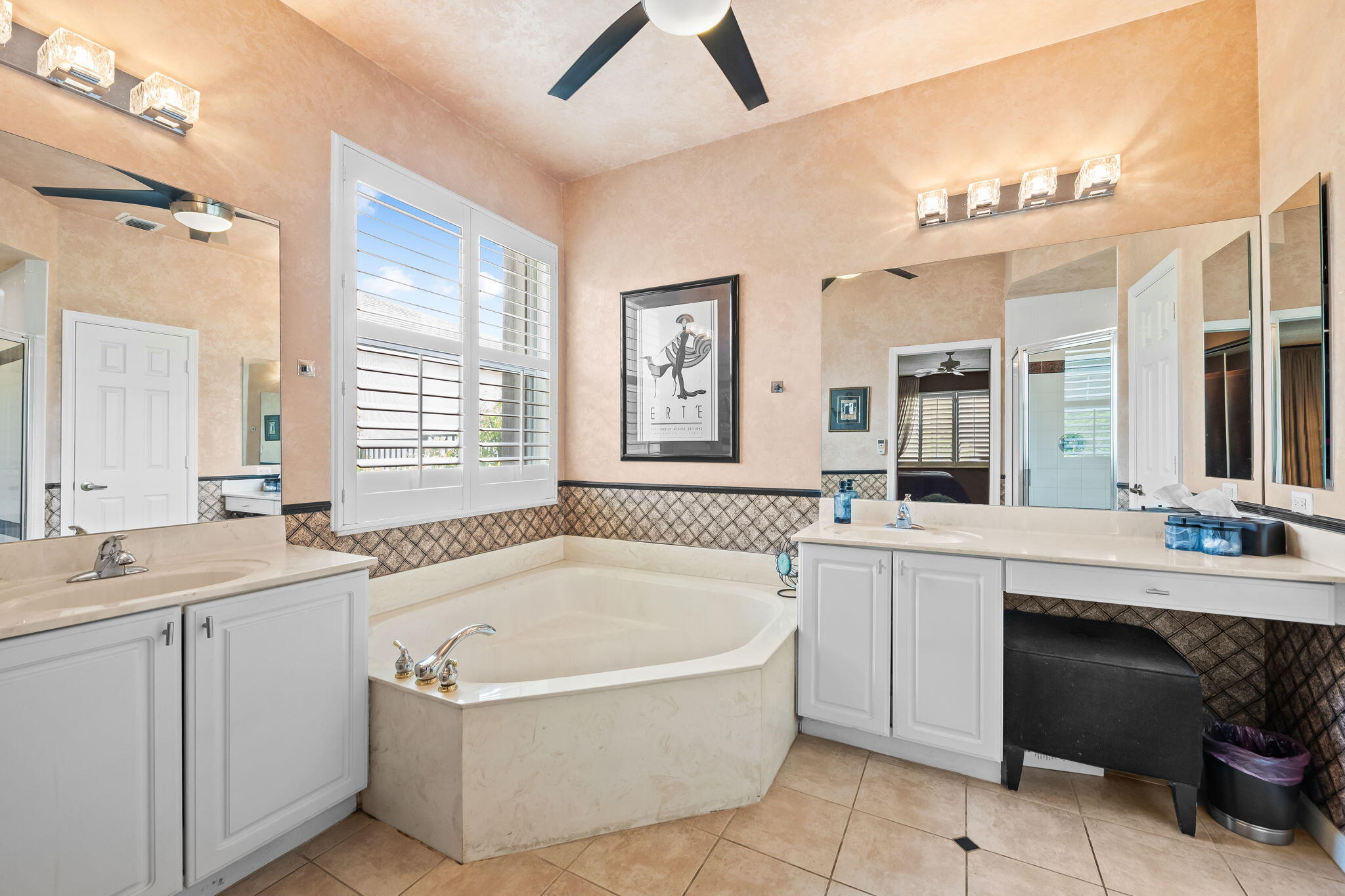 12781 Yardley Drive Boca Raton, FL 33428 - Photo 19 of 55 a bathroom with a tub a sink and mirror