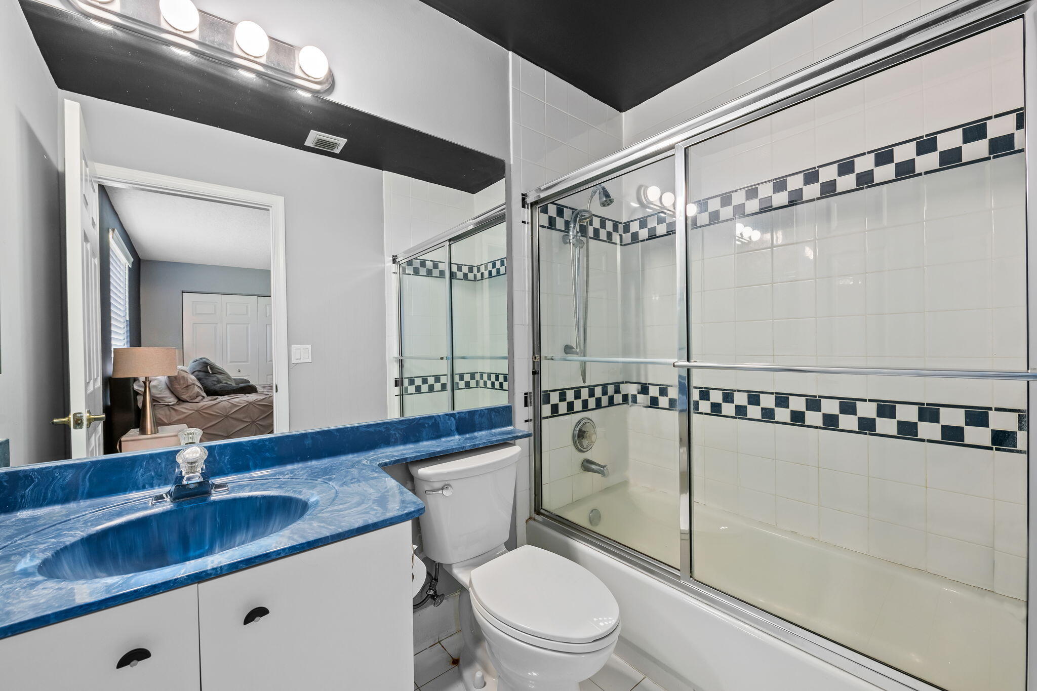 12781 Yardley Drive Boca Raton, FL 33428 - Photo 22 of 55 a bathroom with a granite countertop sink mirror vanity and toilet