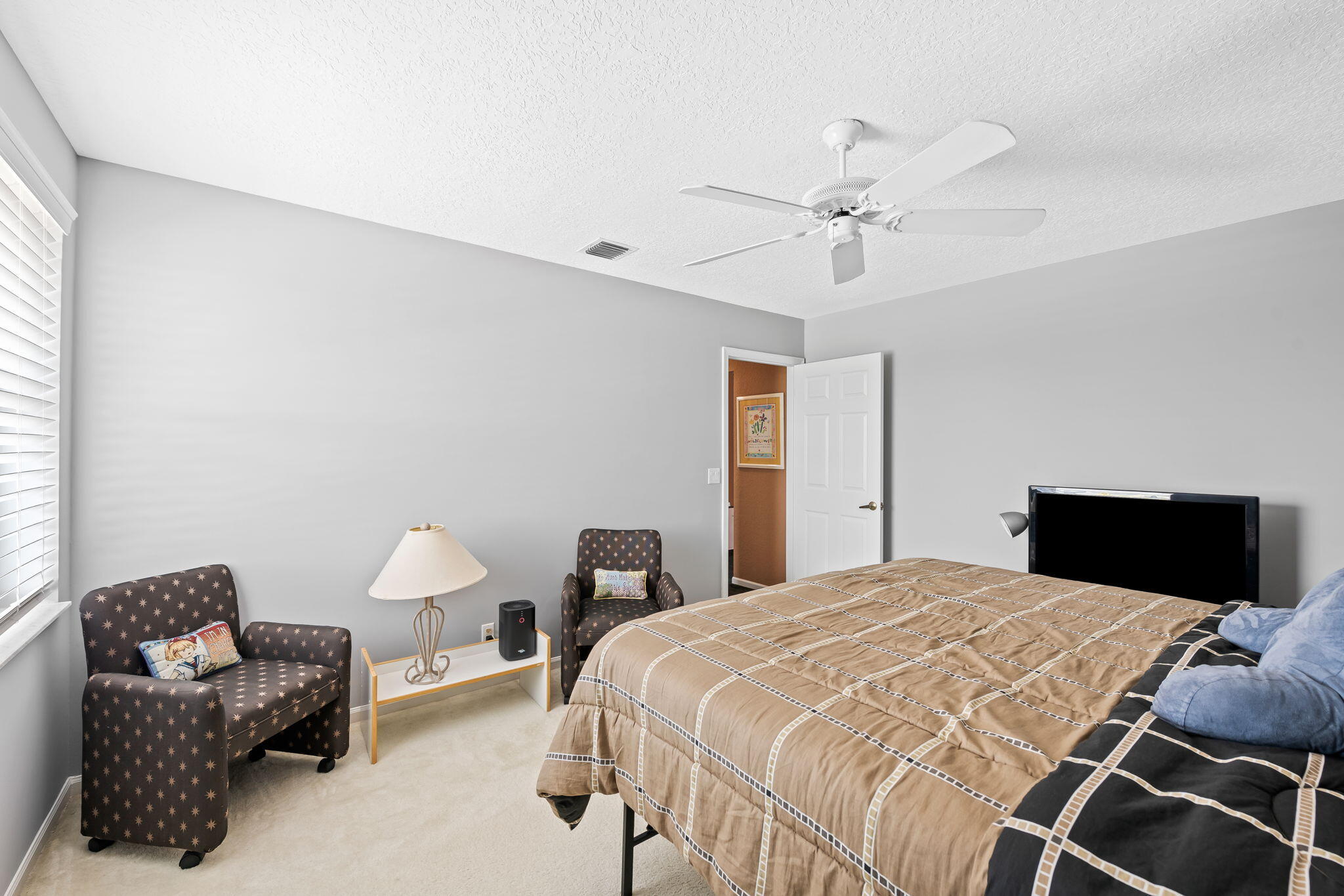 12781 Yardley Drive Boca Raton, FL 33428 - Photo 25 of 55 a bedroom with a bed and ceiling fan