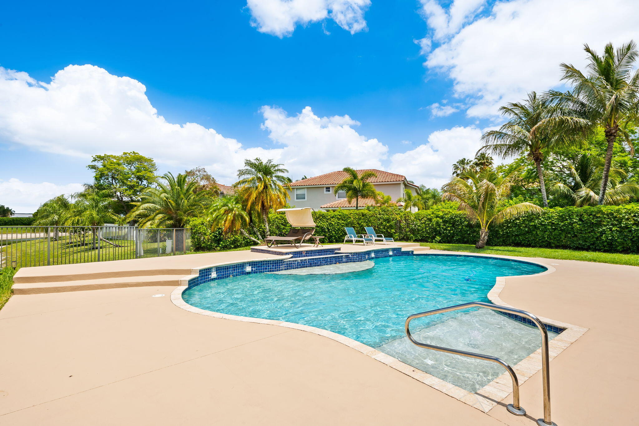 12781 Yardley Drive Boca Raton, FL 33428 - Photo 30 of 55 a view of a swimming pool with a yard