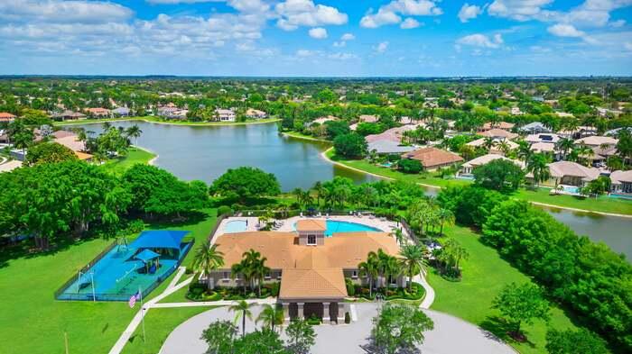 12781 Yardley Drive Boca Raton, FL 33428 - Photo 39 of 55 an aerial view of residential houses with outdoor space and lake view
