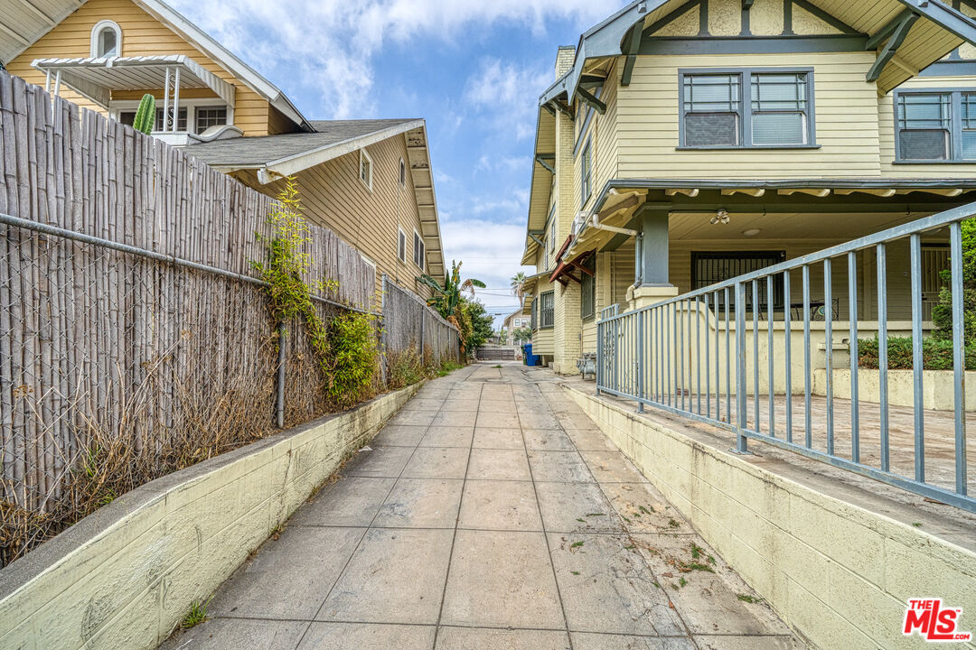 1677 South Harvard Boulevard, Unit UPSTAIRS Los Angeles, CA 90006 - Photo 4 of 19 a view of a pathway with a wrought iron stairs