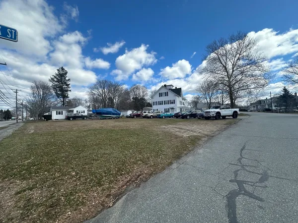 a view of street with parked cars