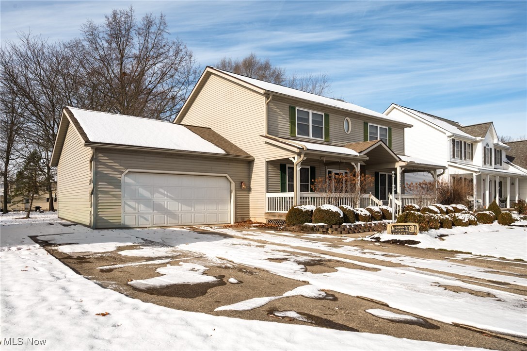 9132 Reed Road North Ridgeville, OH 44039 - Photo 42 of 43 Traditional-style home with a porch and an attached garage