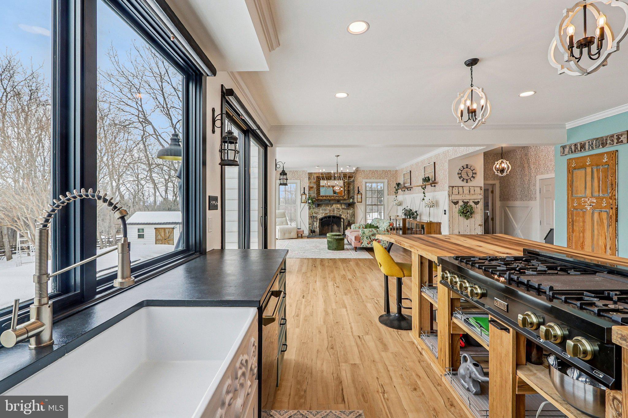 19075 Foxgreen Circle Leesburg, VA 20175 - Photo 18 of 71 a kitchen with stainless steel appliances granite countertop a stove and a wooden floors