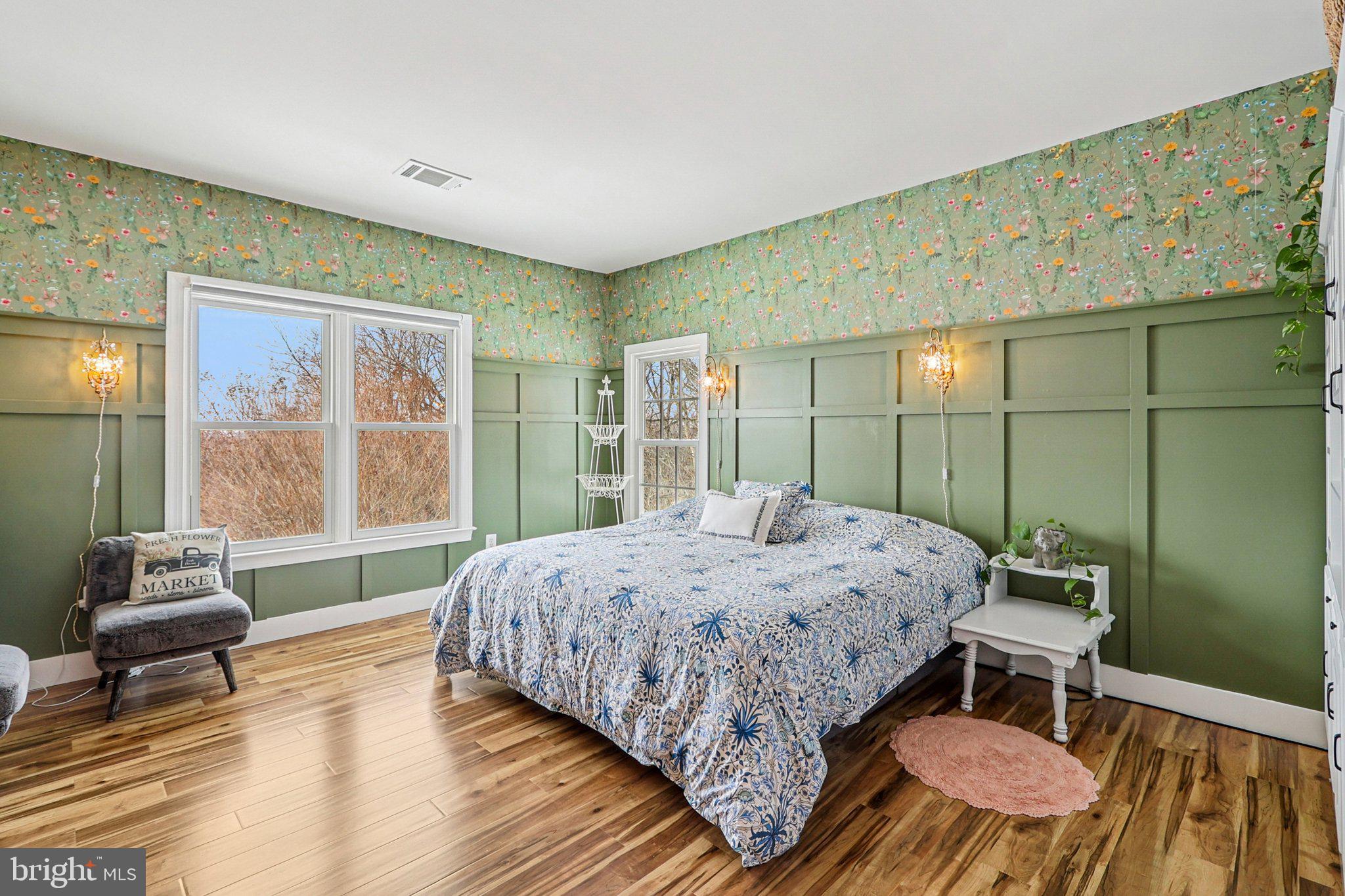 19075 Foxgreen Circle Leesburg, VA 20175 - Photo 27 of 71 a bedroom with a bed and wooden floor