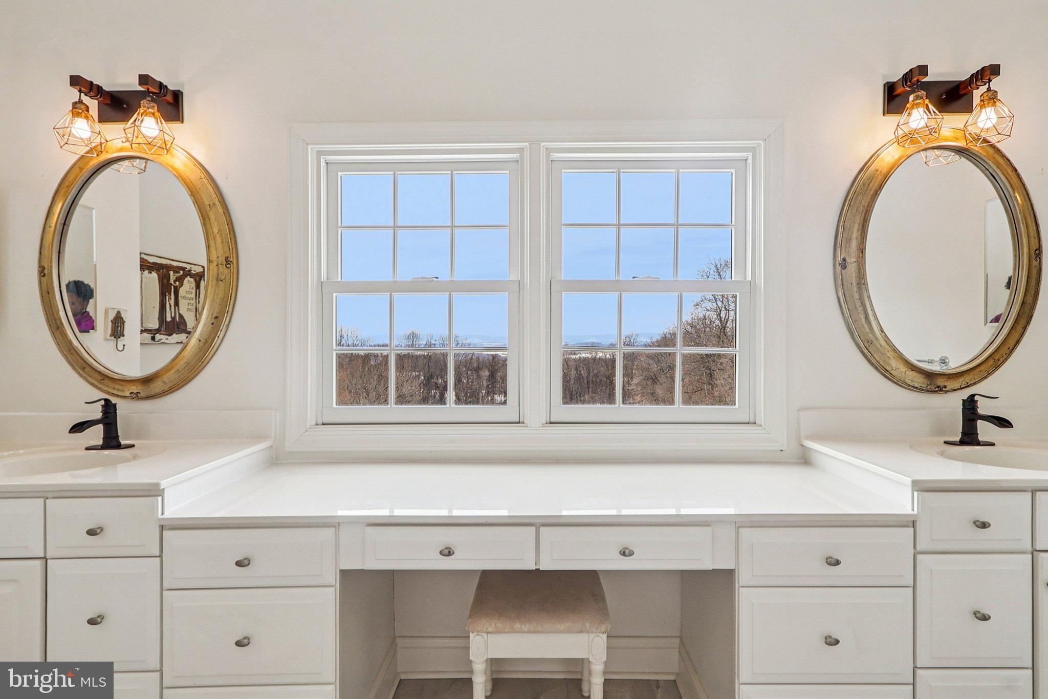 19075 Foxgreen Circle Leesburg, VA 20175 - Photo 36 of 71 a bathroom with a sink and a mirror
