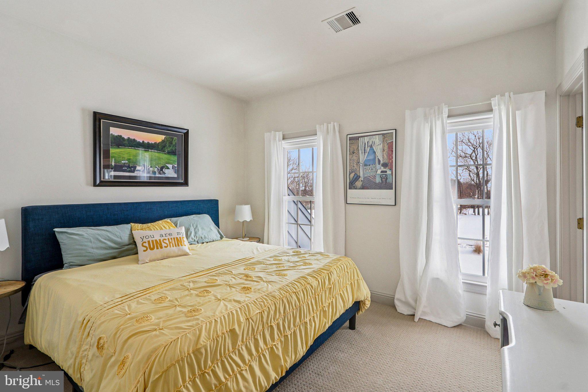19075 Foxgreen Circle Leesburg, VA 20175 - Photo 38 of 71 a bedroom with a large bed and painting on the wall
