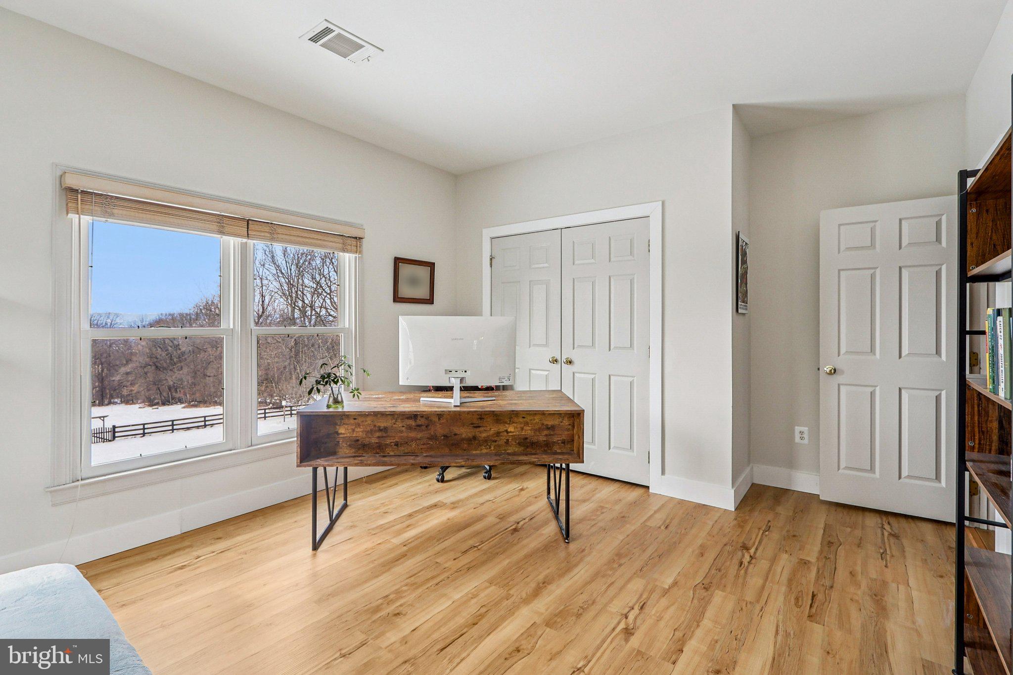 19075 Foxgreen Circle Leesburg, VA 20175 - Photo 42 of 71 a view of a workspace with wooden floor and a window