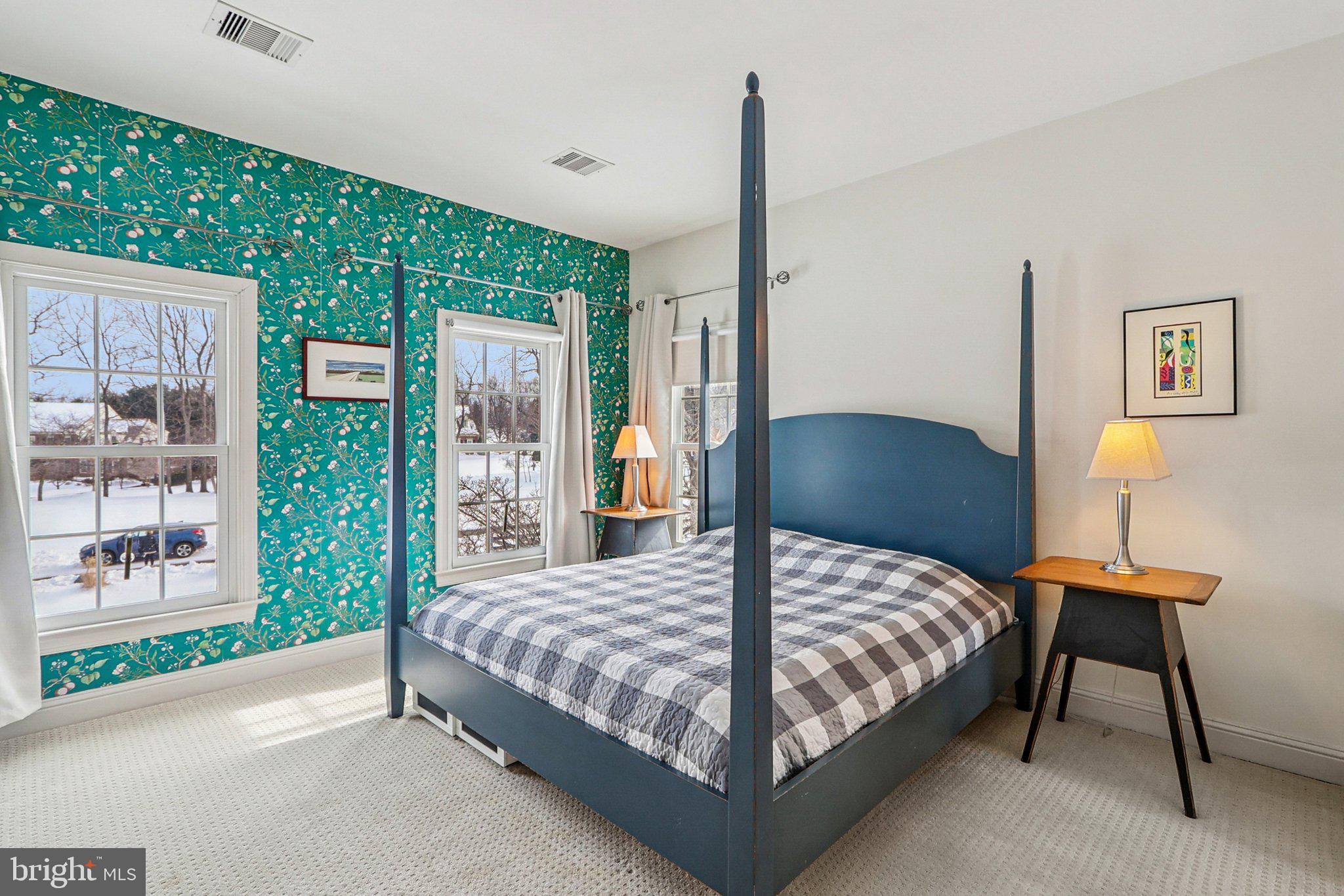 19075 Foxgreen Circle Leesburg, VA 20175 - Photo 46 of 71 a bedroom with a bed lamp and a large window