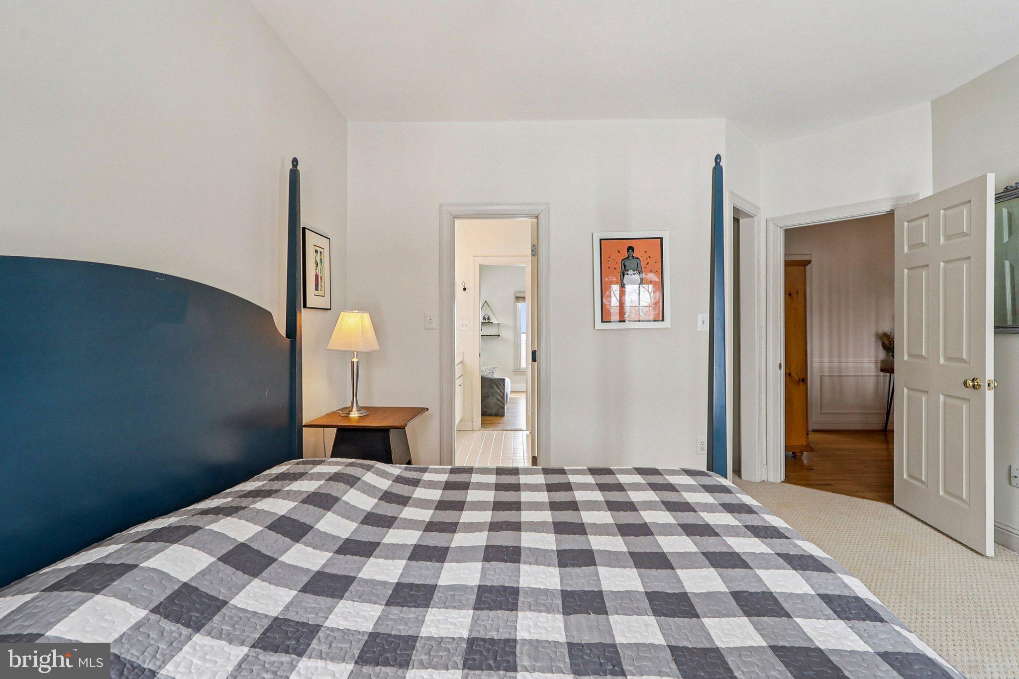 19075 Foxgreen Circle Leesburg, VA 20175 - Photo 47 of 71 a bedroom with a bed and wooden floor