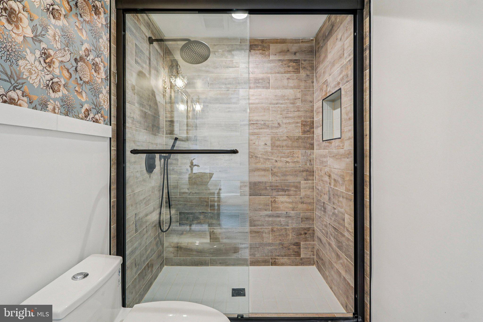 19075 Foxgreen Circle Leesburg, VA 20175 - Photo 60 of 71 a bathroom with a glass shower door