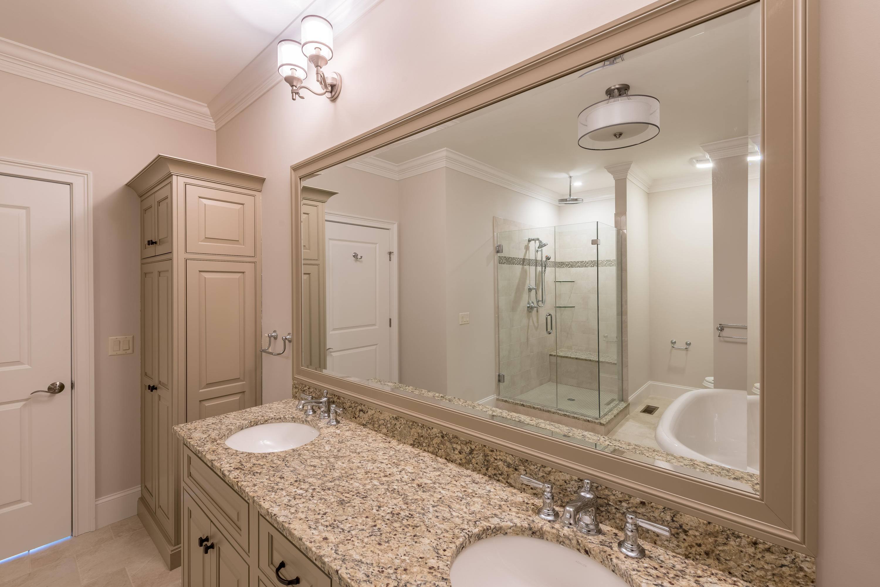 40 Clayton Circle, Unit B Mashpee, MA 02649 - Photo 8 of 11 a bathroom with a granite countertop sink and a mirror