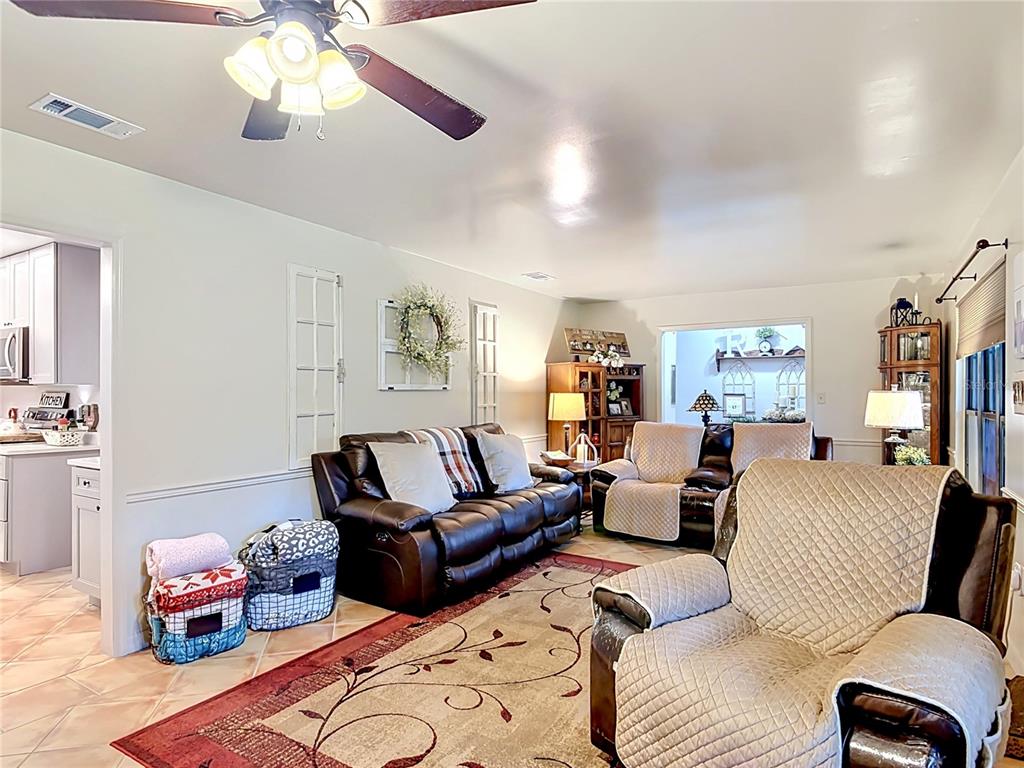 1395 Maytown Road Osteen, FL 32764 - Photo 14 of 65 a living room with furniture