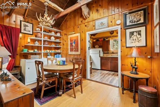 6015 Sioux Trail Cascade, CO 80809 - Photo 11 of 42 a view of a dining room with furniture and chandelier