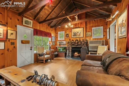 6015 Sioux Trail Cascade, CO 80809 - Photo 12 of 42 a living room with furniture a fireplace and a table