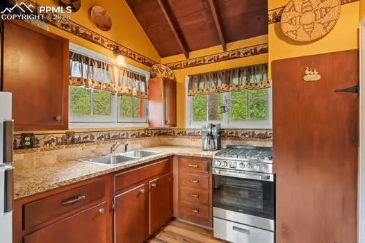 6015 Sioux Trail Cascade, CO 80809 - Photo 14 of 42 a kitchen with a sink and a stove