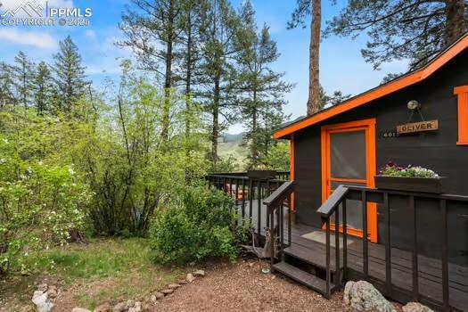 6015 Sioux Trail Cascade, CO 80809 - Photo 25 of 42 a view of a house with large windows
