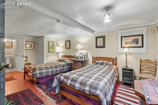 6015 Sioux Trail Cascade, CO 80809 - Photo 30 of 42 a bedroom with two beds and painting on the wall