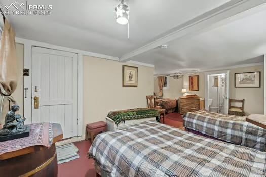 6015 Sioux Trail Cascade, CO 80809 - Photo 32 of 42 a bedroom with a bed a couch and dresser