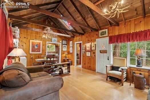 6015 Sioux Trail Cascade, CO 80809 - Photo 8 of 42 a living room with furniture and a chandelier