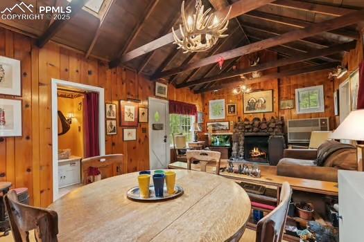 6015 Sioux Trail Cascade, CO 80809 - Photo 9 of 42 a room with fireplace lots of furniture and a chandelier