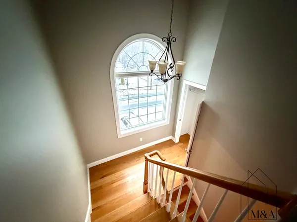a view of an entryway with wooden floor