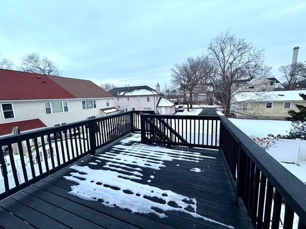 a view of a wooden deck with a patio
