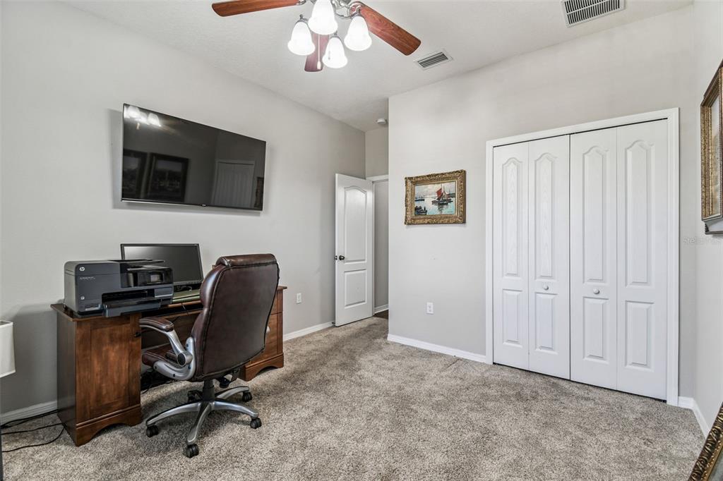 11150 Paradise Pointe Way New Port Richey, FL 34654 - Photo 25 of 91 a view of a workspace with furniture and a window