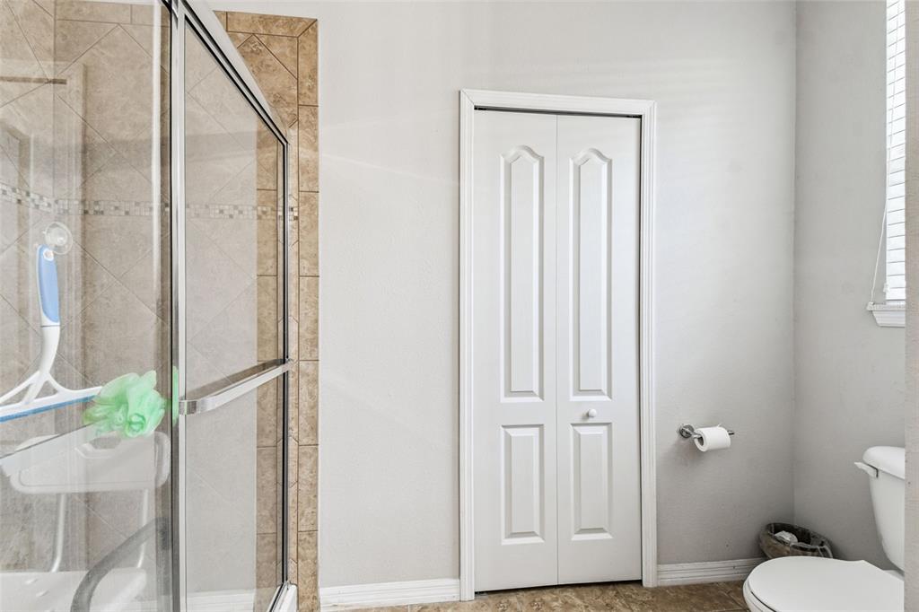 11150 Paradise Pointe Way New Port Richey, FL 34654 - Photo 33 of 91 a bathroom with a granite countertop window and a toilet