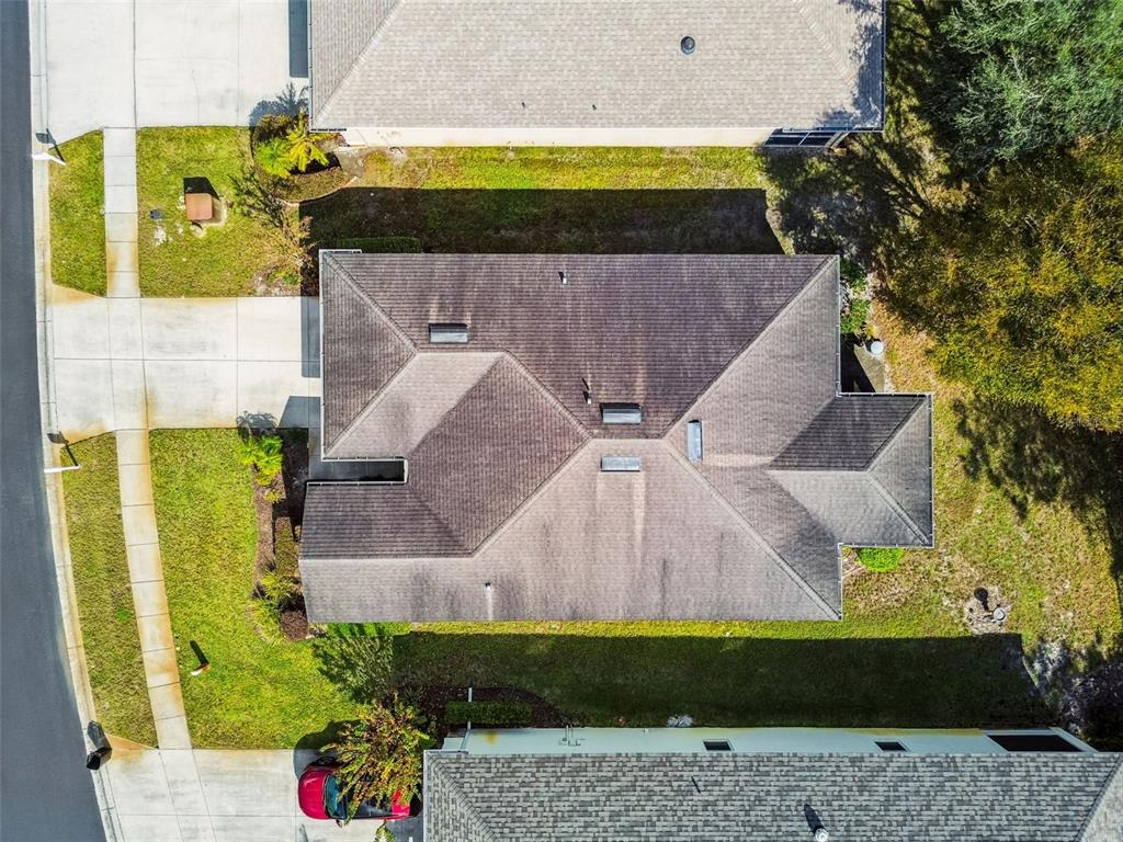 11150 Paradise Pointe Way New Port Richey, FL 34654 - Photo 41 of 91 a aerial view of a house with a yard