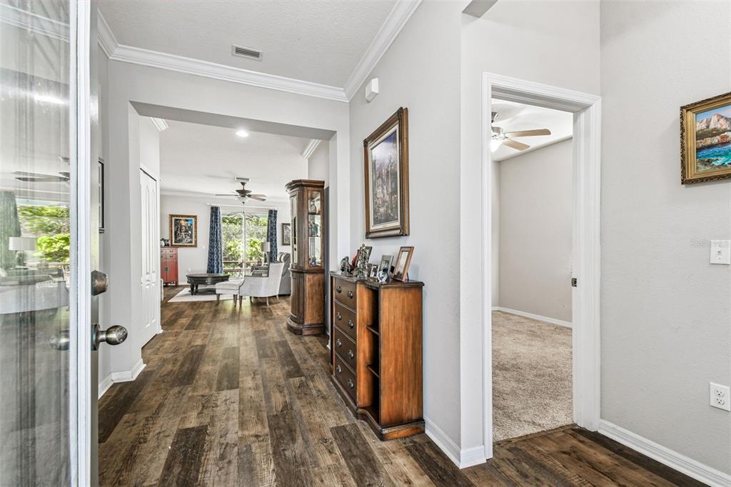 11150 Paradise Pointe Way New Port Richey, FL 34654 - Photo 5 of 91 a very nice looking room with a large bed and wooden floor