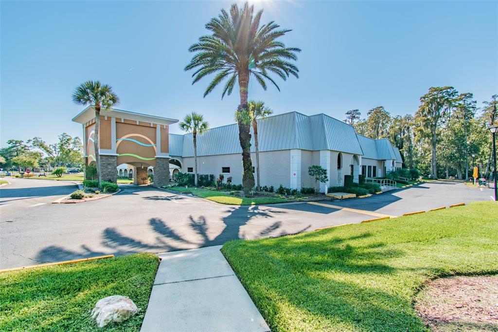 11150 Paradise Pointe Way New Port Richey, FL 34654 - Photo 67 of 91 a front view of house with yard and green space