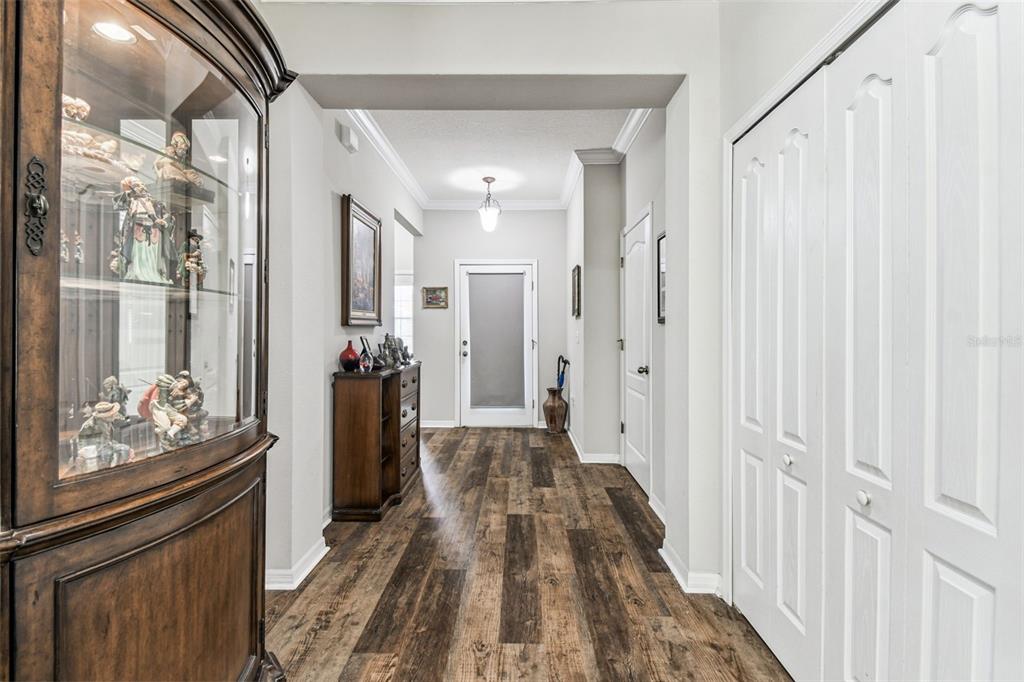 11150 Paradise Pointe Way New Port Richey, FL 34654 - Photo 7 of 91 a view of a hallway with wooden floor and staircase