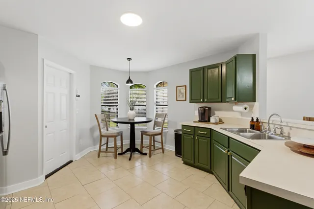 a view of a kitchen area with furniture and window