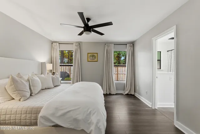 a bedroom with a large bed and a window