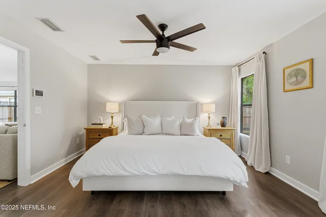 a bedroom with a bed and window