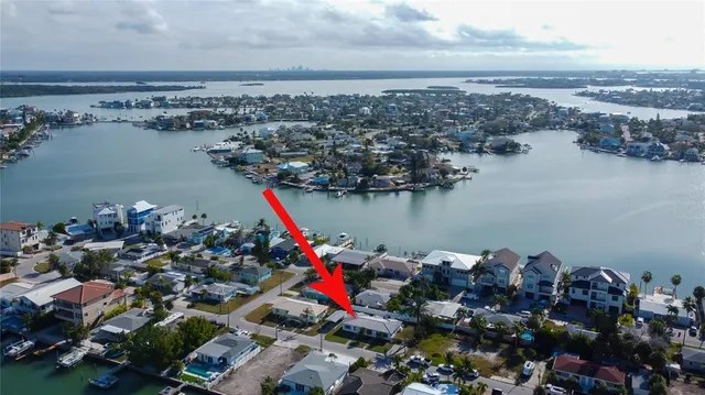 a front view of house with a garden