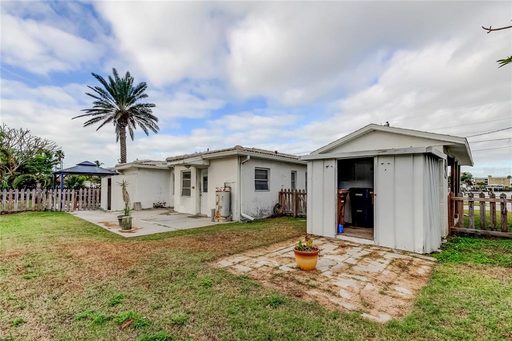 245 145th Avenue Madeira Beach, FL 33708 - Photo 15 of 41 a view of a house with backyard and couches