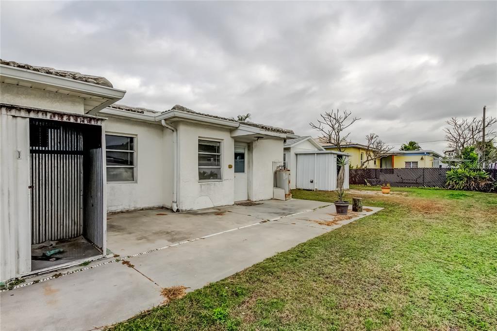 245 145th Avenue Madeira Beach, FL 33708 - Photo 18 of 41 a view of a house with backyard and sitting area
