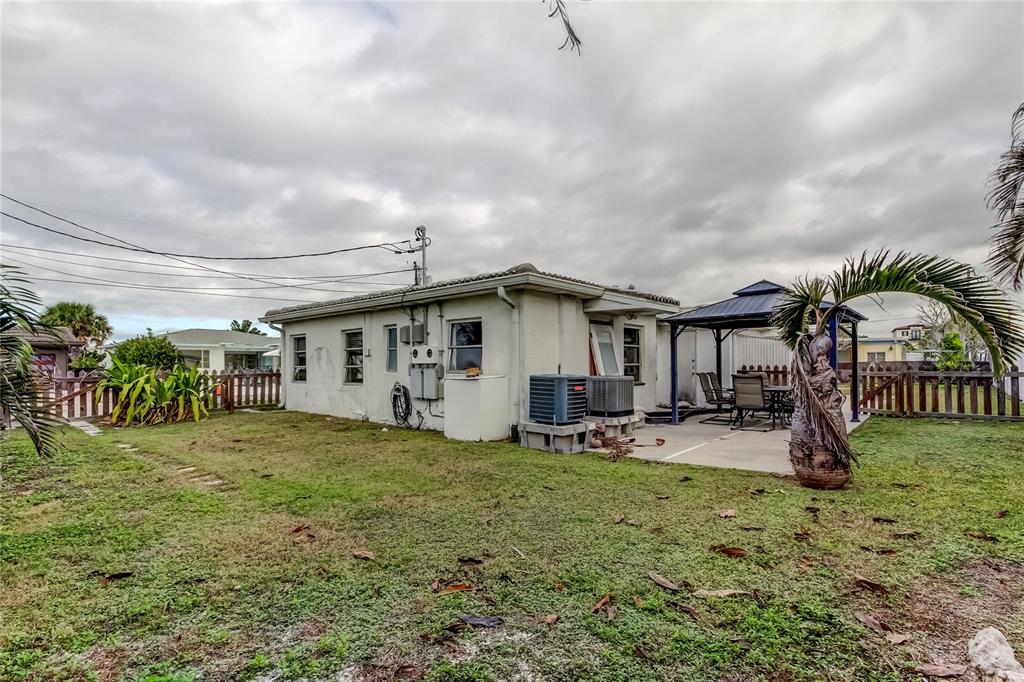 245 145th Avenue Madeira Beach, FL 33708 - Photo 20 of 41 a view of a house with garden