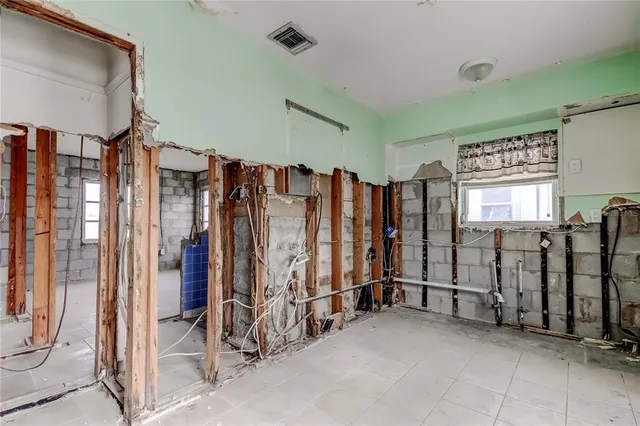 a view of a hallway with furniture